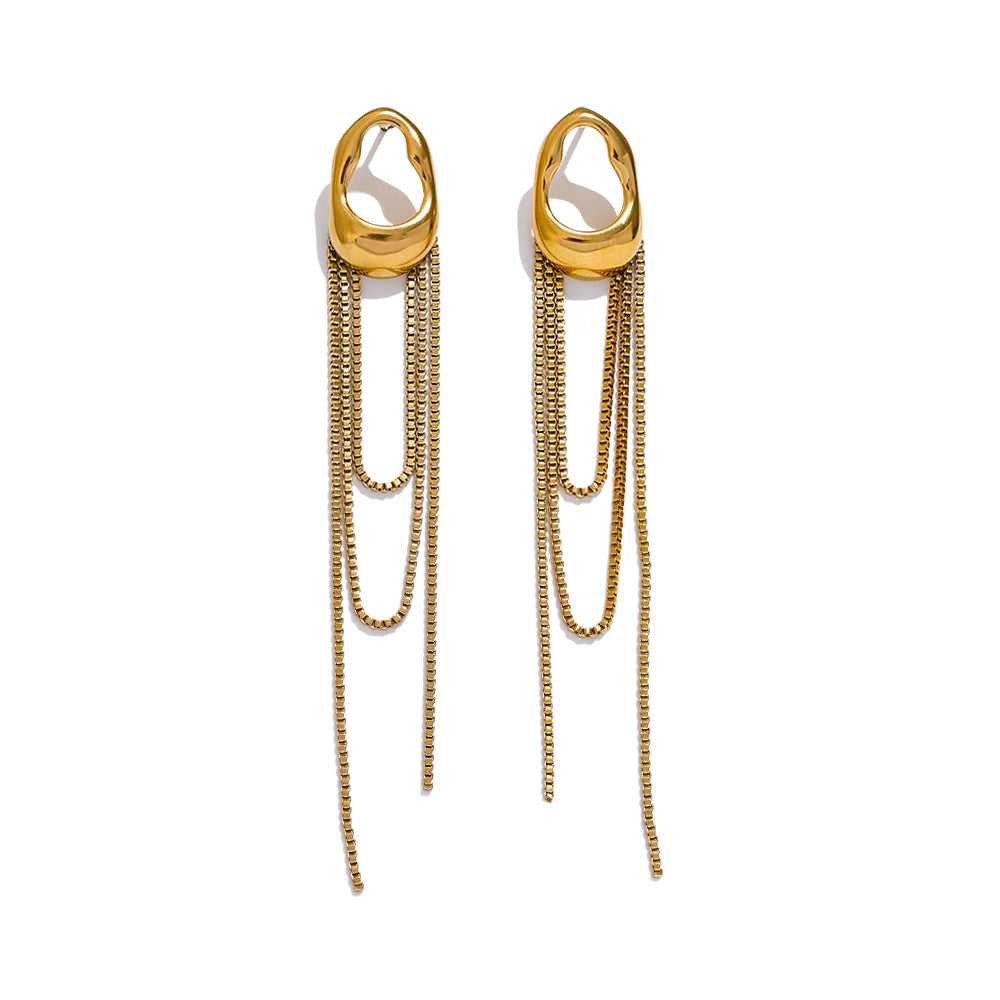 Long dangly earrings in gold on white background