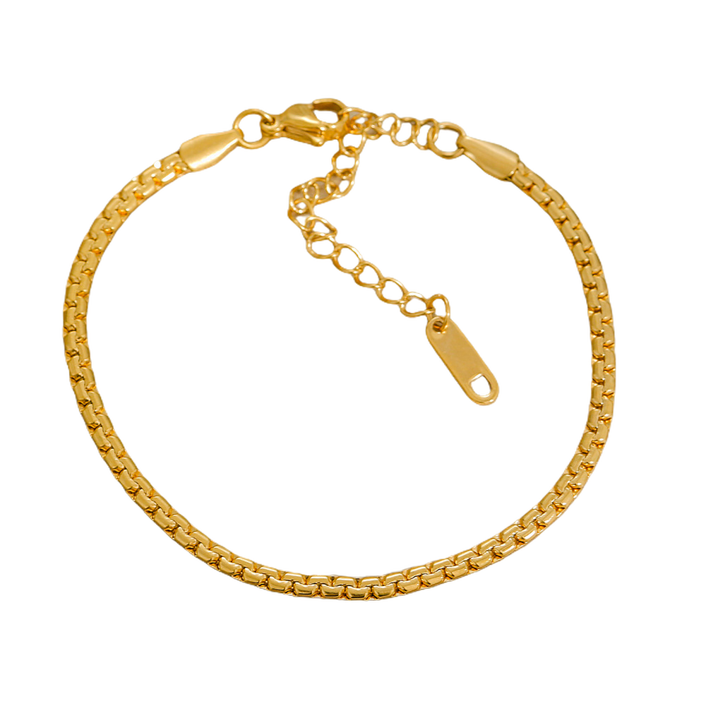 Gold stainless steel bracelet on a white background