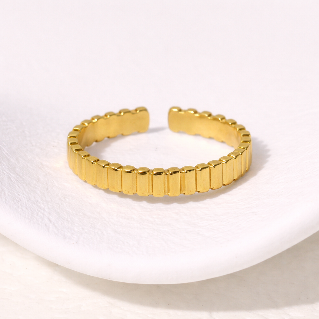 Simple gold ring on a white background
