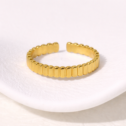 Simple gold ring on a white background