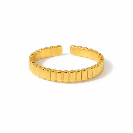 minimalist gold ring on white background