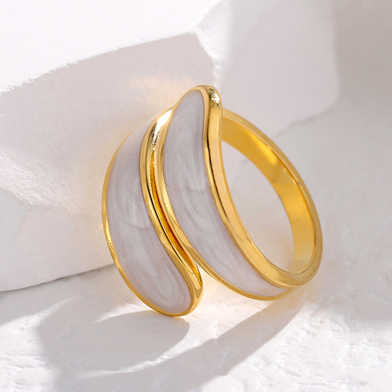 Gold tarnish-free ring on a white fabric background
