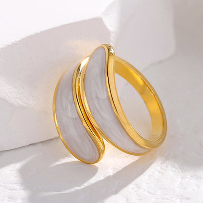 Gold tarnish-free ring on a white fabric background