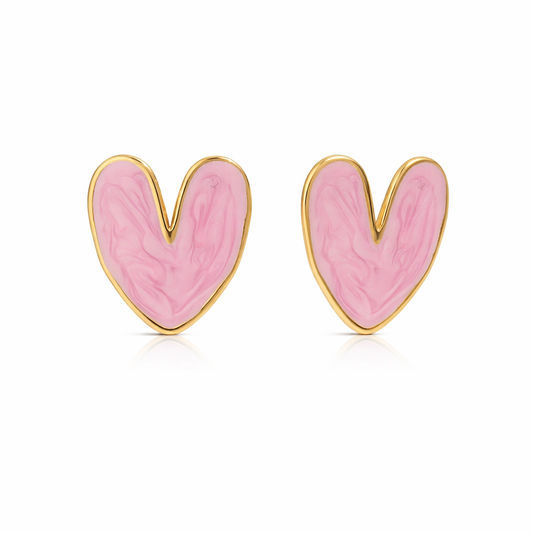 Heart-shaped pink earrings with gold accents on a white background