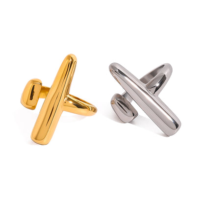 Gold and silver statement rings on a white background