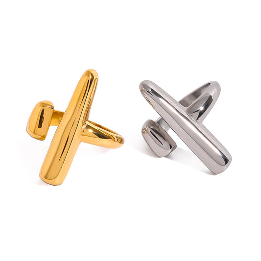 Gold and silver statement rings on a white background