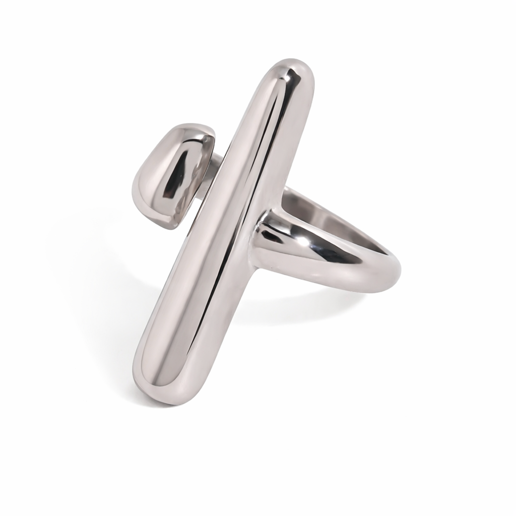 Silver ring with a unique design on a white background