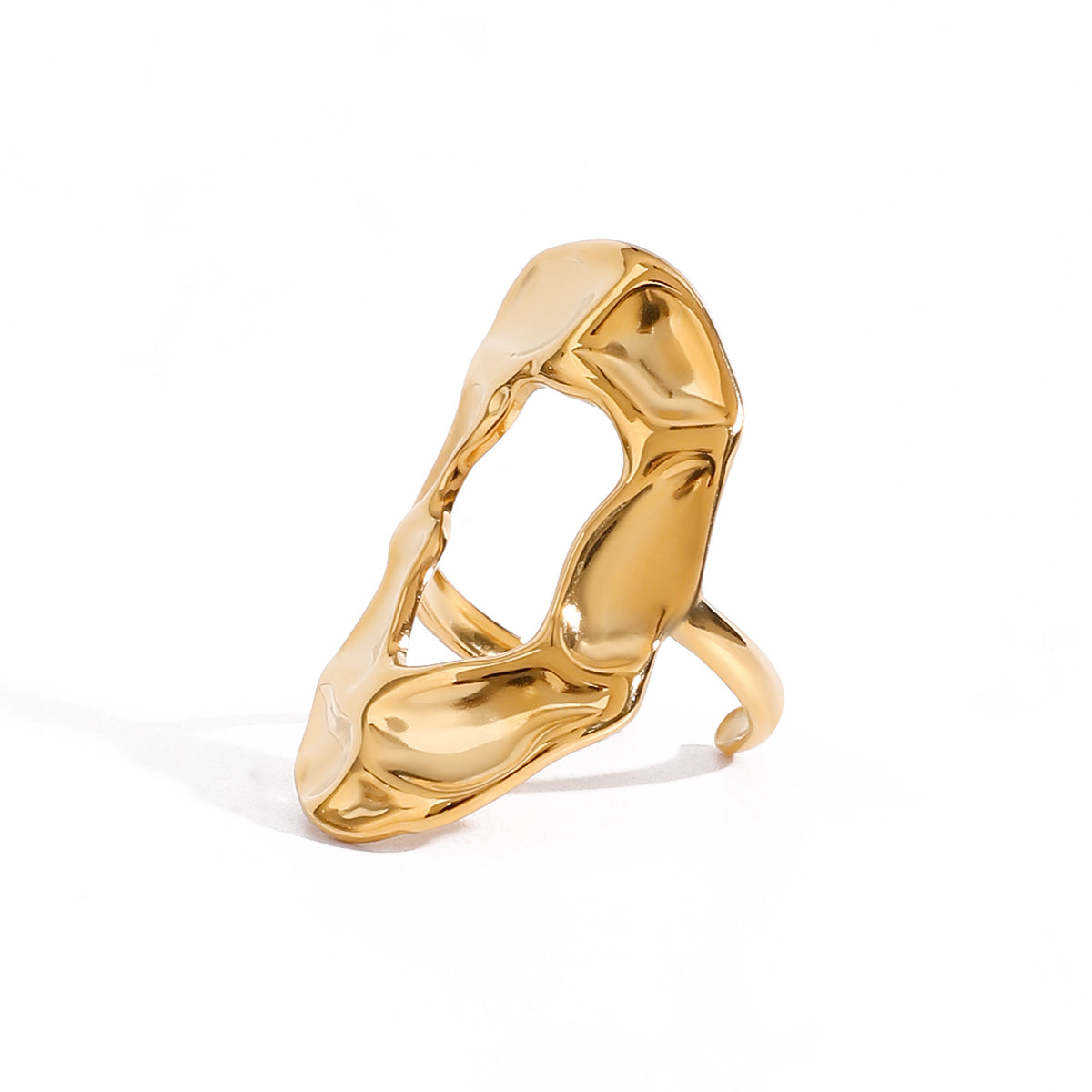Gold statement ring with a modern design on a white background