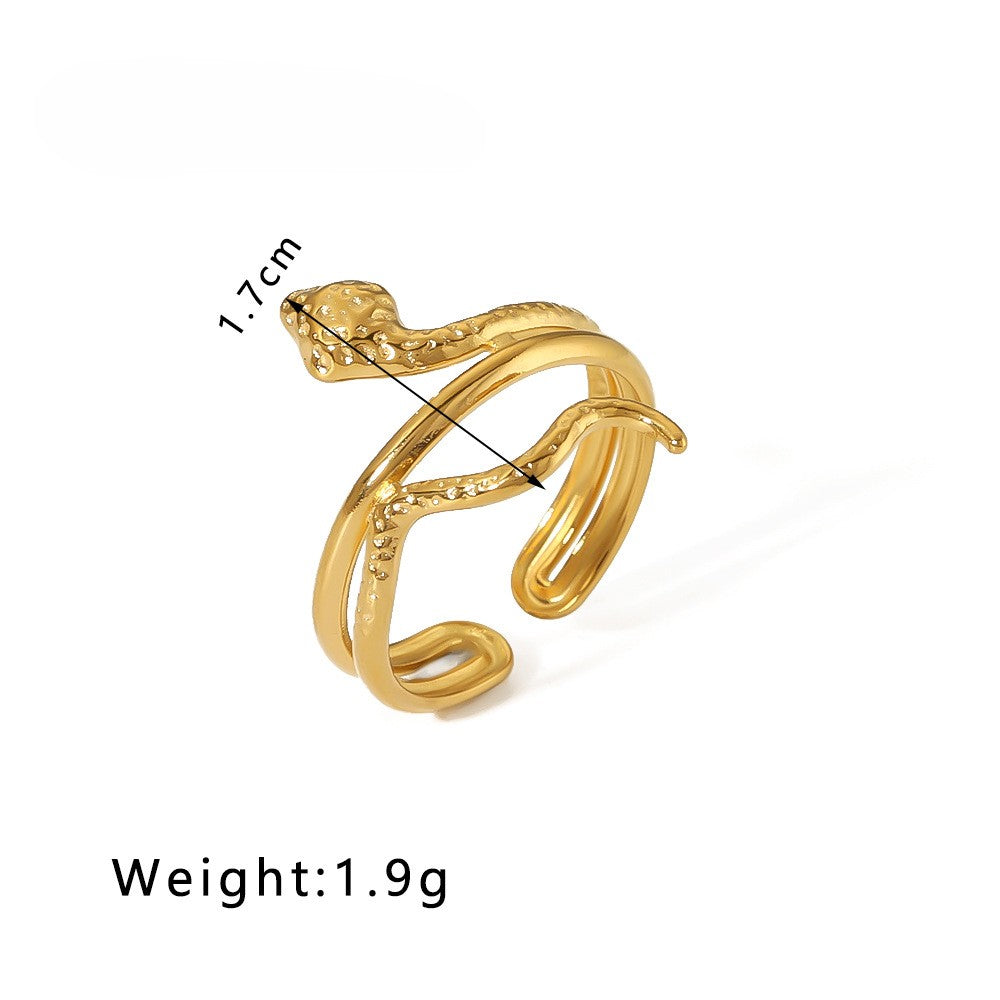gold snake-shaped ring on white background with measurements