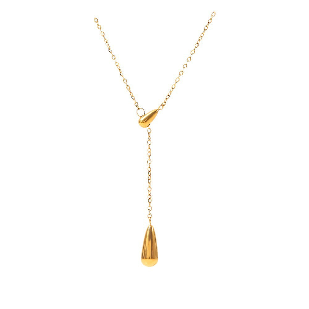 Gold stainless steel necklace with a teardrop pendant on a white background