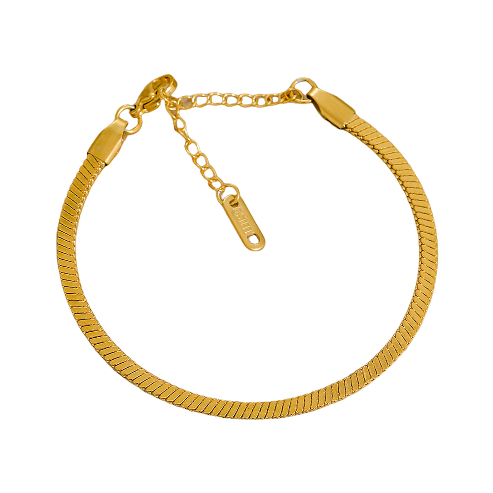 Gold stainless steel bracelet on a white background
