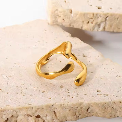 Gold ring on a textured stone surface