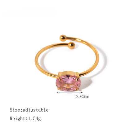 Gold ring with a pink gemstone on a white background
