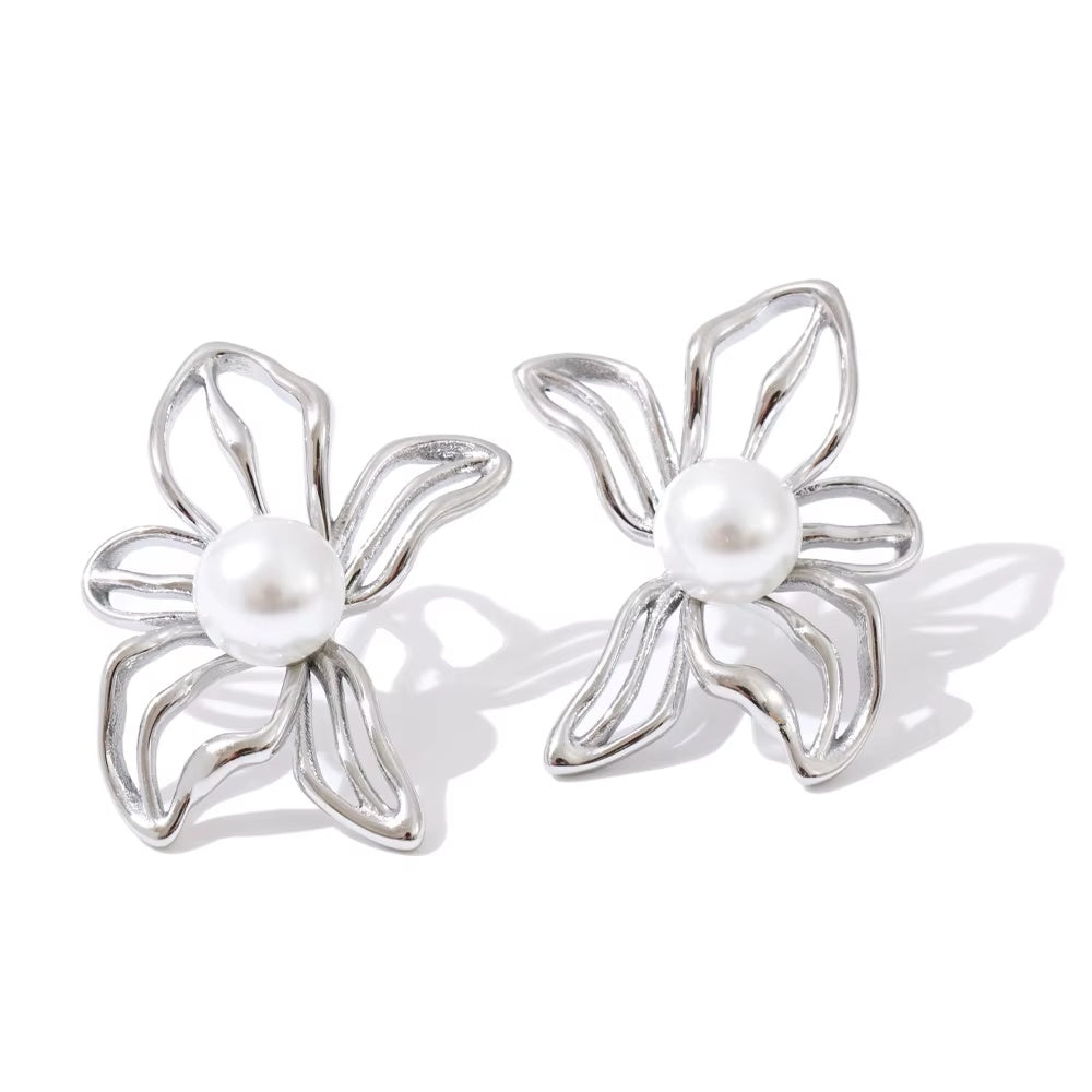 elegant silver studs in the shape of flower with pearl center