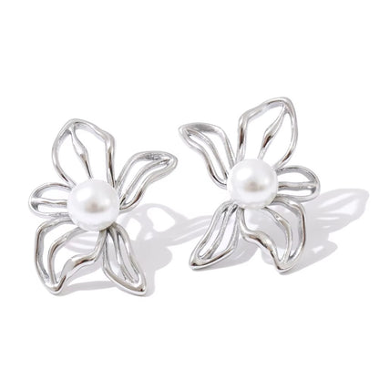 elegant silver studs in the shape of flower with pearl center