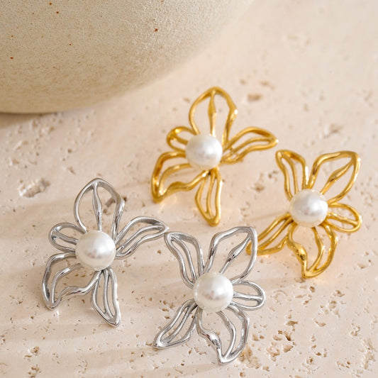 elegant gold and silver studs in the shape of flower with pearl center