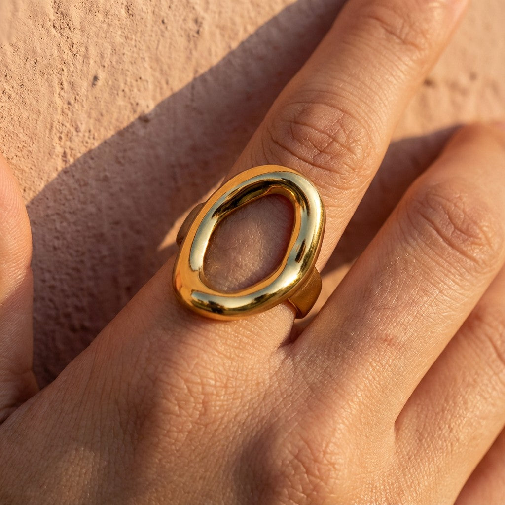 gold beach-friendly ring on a person's hand