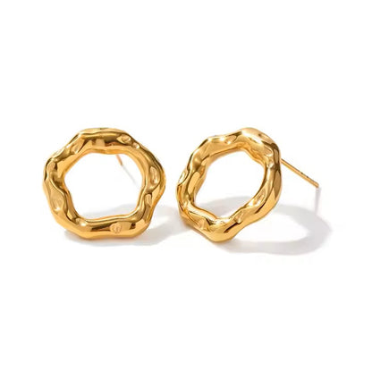 Gold hoop earrings on a white background