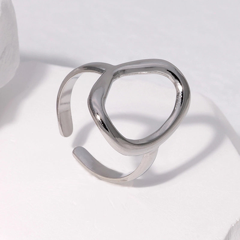 Silver waterproof ring with a unique design on a light background