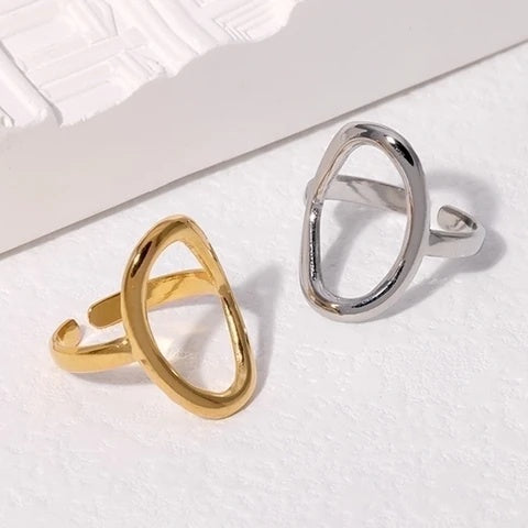 Gold and silver waterproof rings on a white surface