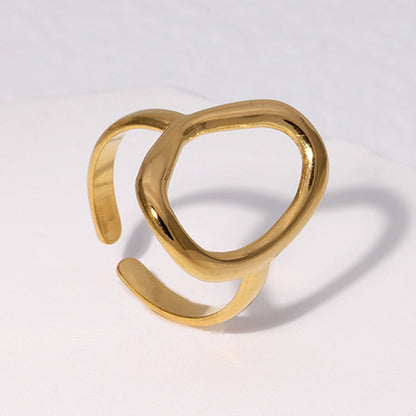 Gold waterproof open ring on a light gray background