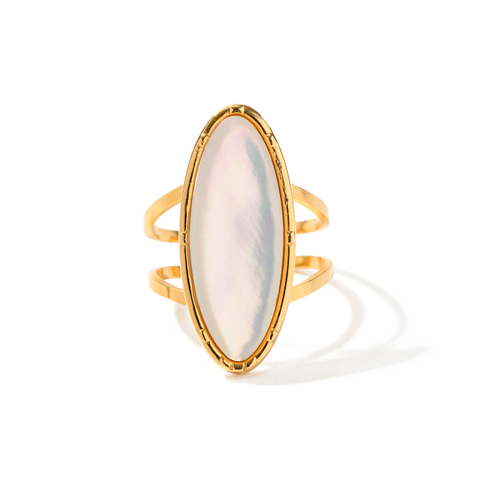 Large gold ring with pearl on white background