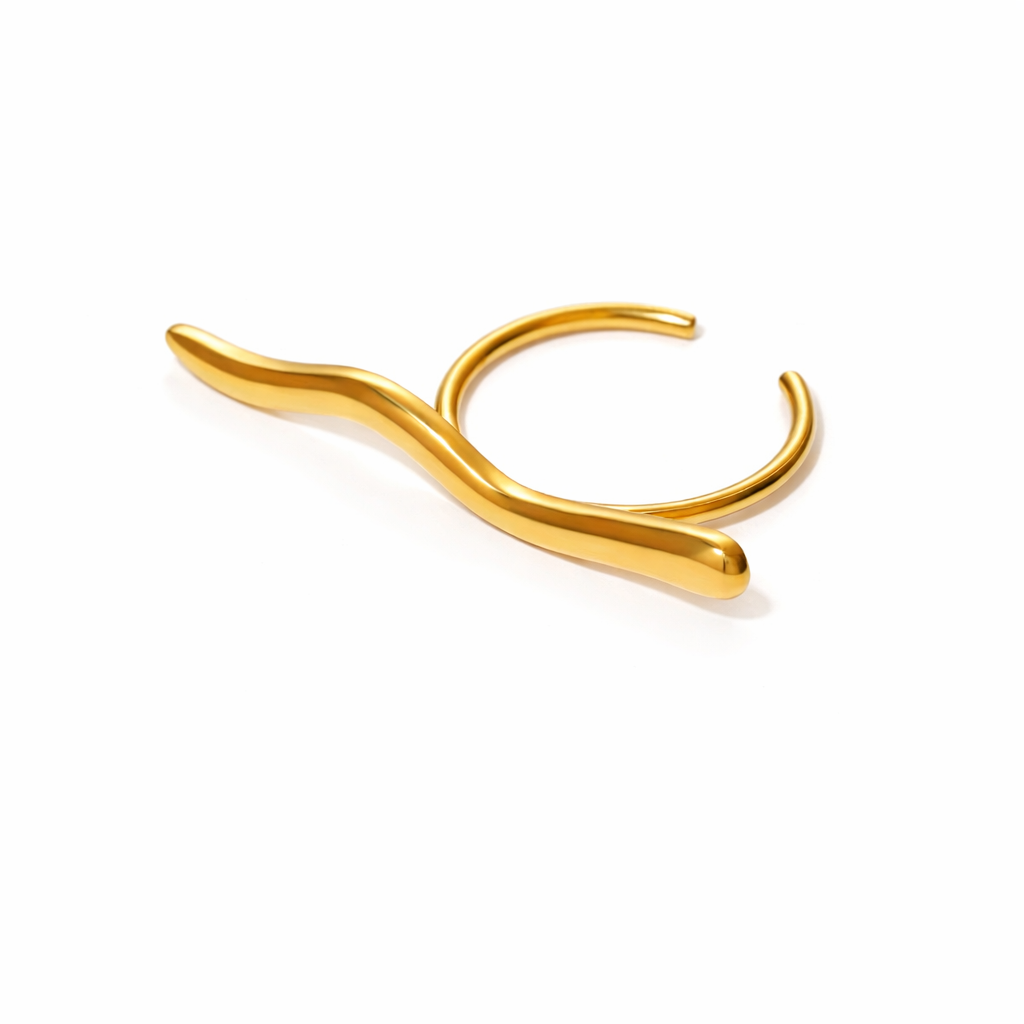 Gold minimalist stainless steel ring on a white background