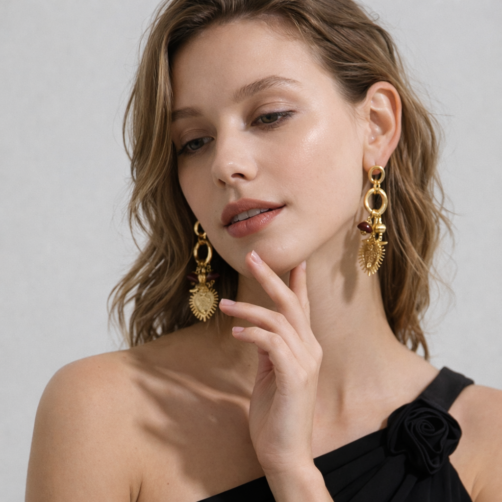Woman wearing statement gold earrings with a neutral background