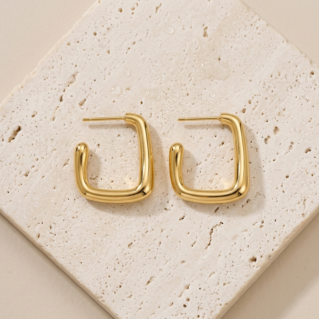 Gold rectangular hoop earrings made from waterproof stainless steel, featuring a polished finish and modern geometric design, Pola Grace.
