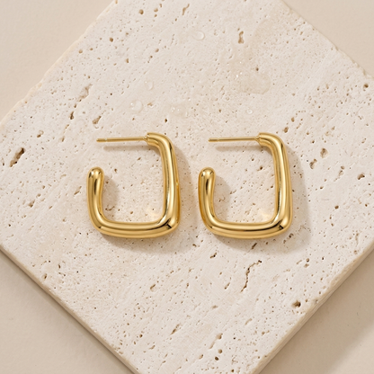 Gold rectangular hoop earrings made from waterproof stainless steel, featuring a polished finish and modern geometric design, Pola Grace.