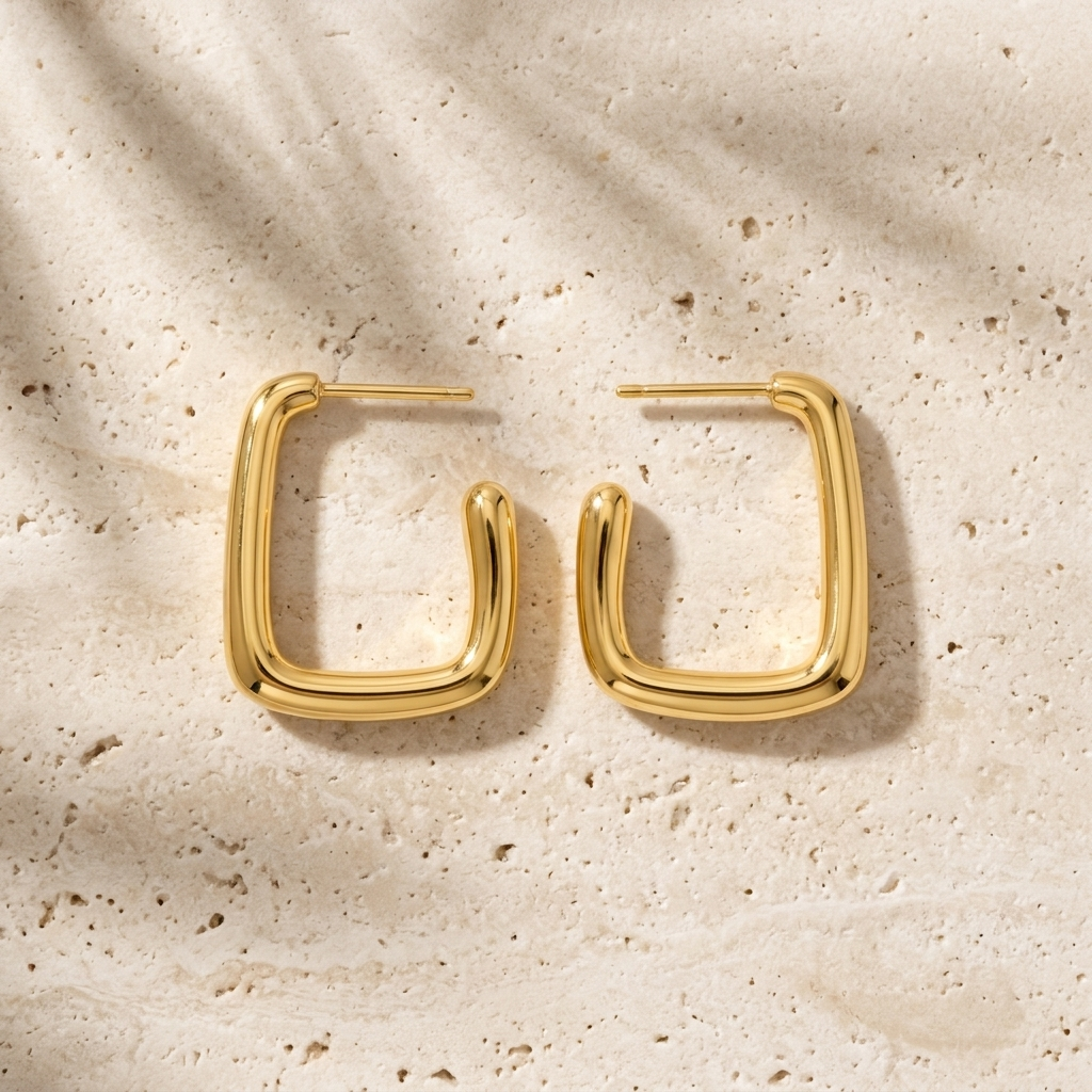 Gold rectangular hoop earrings made from waterproof stainless steel, featuring a polished finish and modern geometric design, Pola Grace.