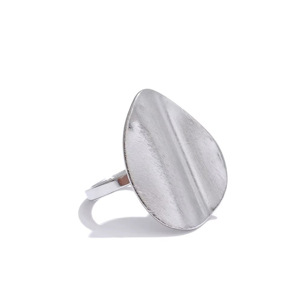 Silver ring with a textured surface on a white background