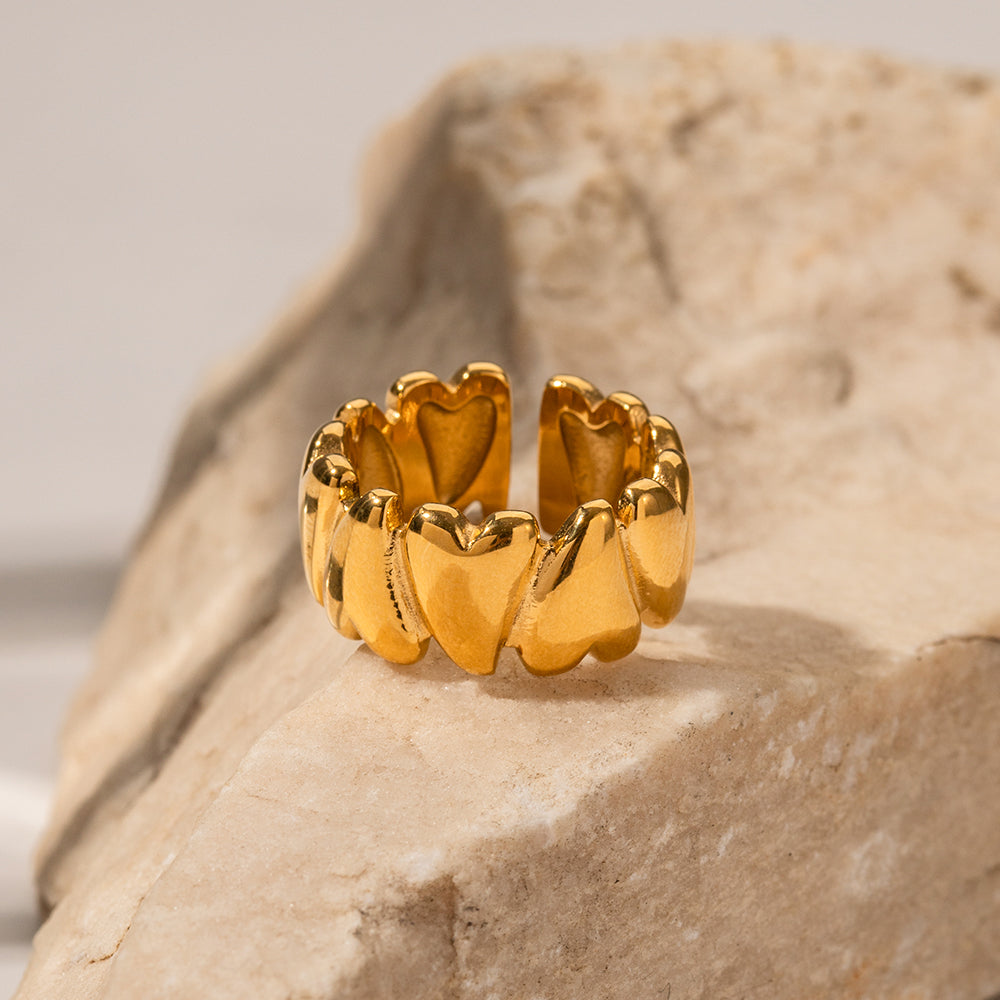 Gold ring with a unique design on a stone surface