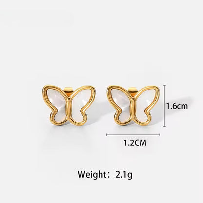 Gold butterfly-shaped earrings with measurements and weight on a white background