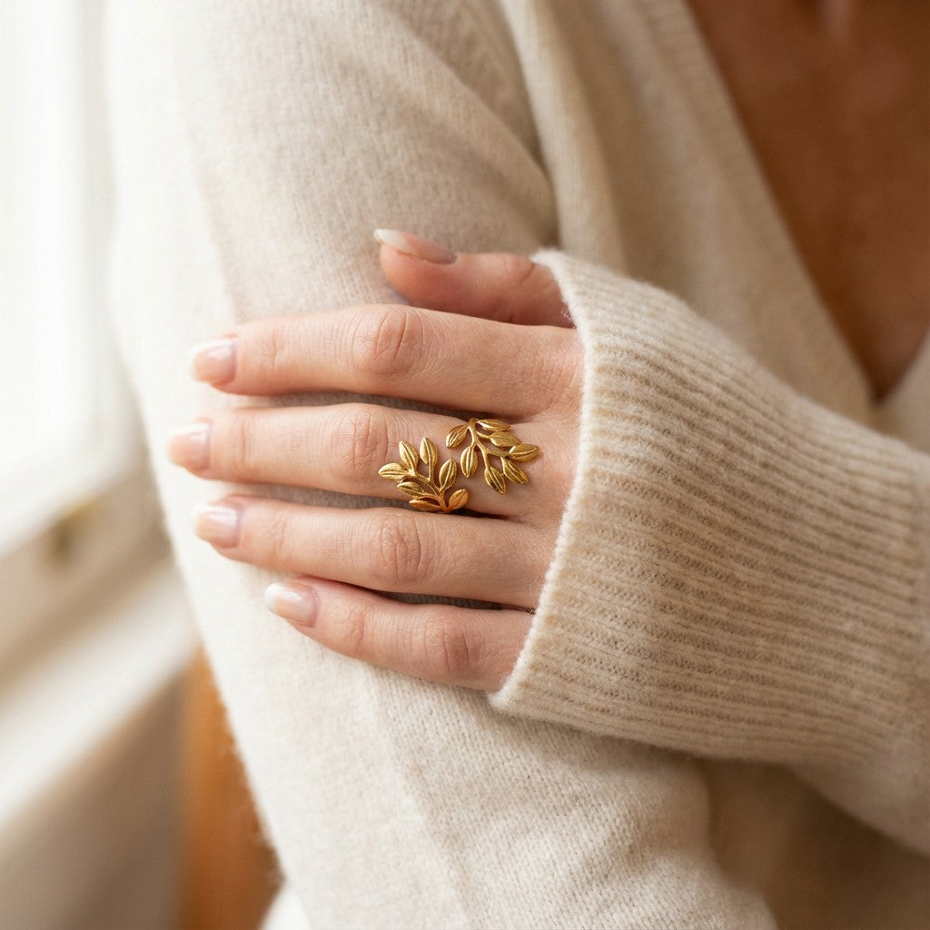 leaf-shaped gold ring on female hand