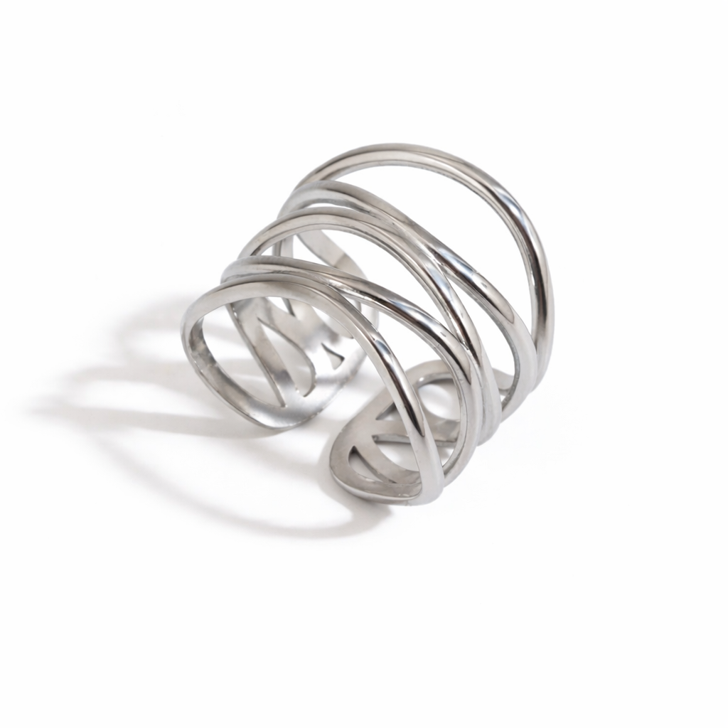 Silver ring with multiple intertwined loops on a white background