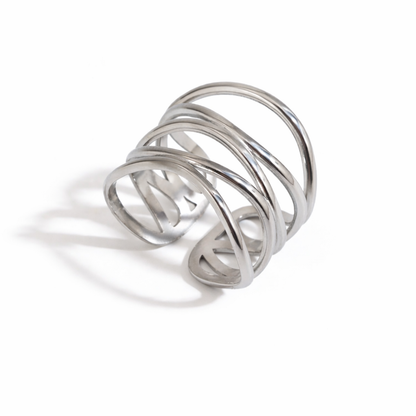 Silver ring with multiple intertwined loops on a white background