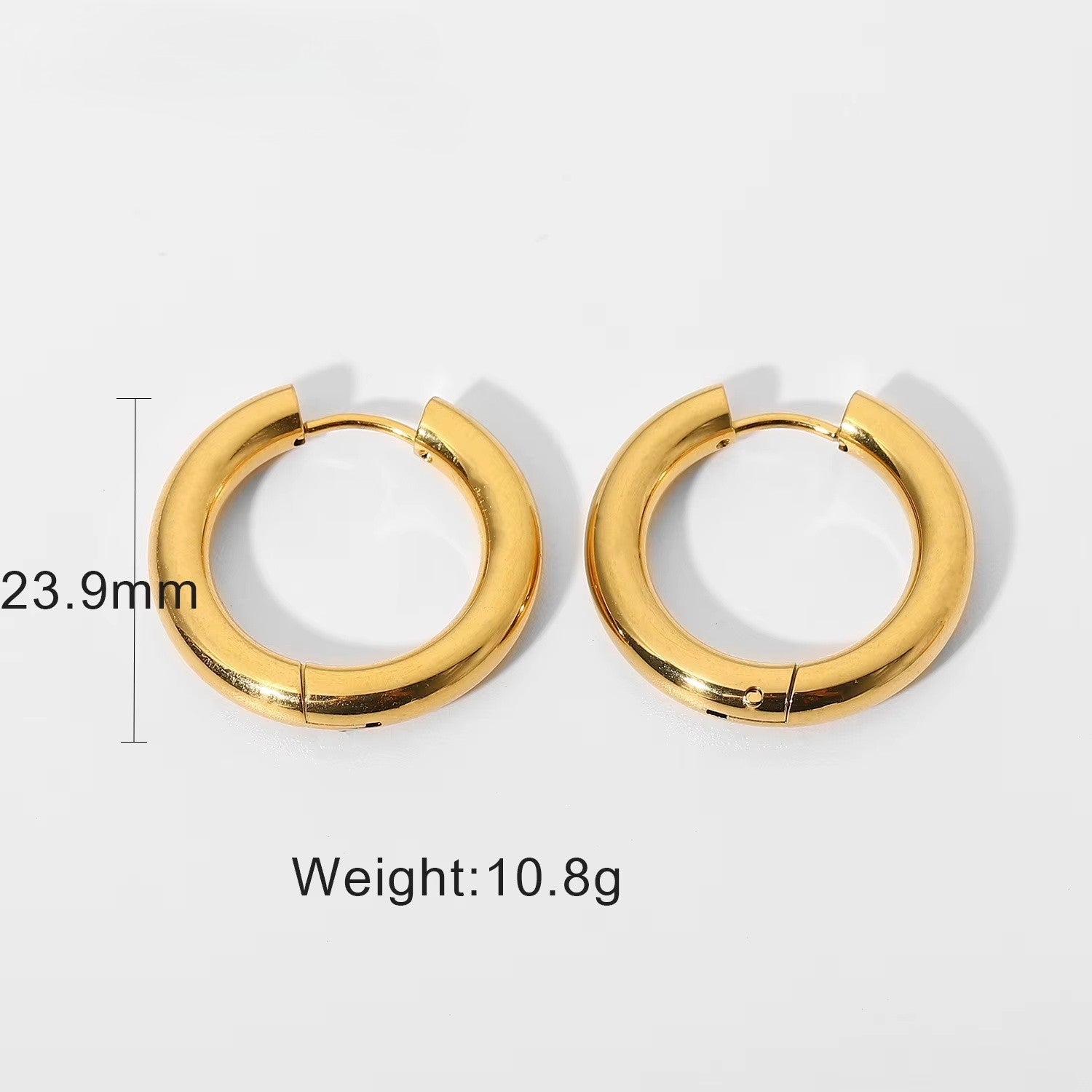 Simple gold hoop earrings with measurements and weight on a white background