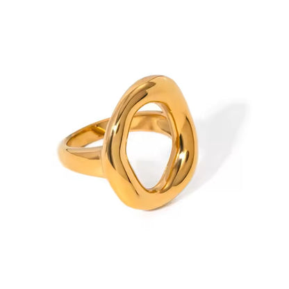 Gold stainless steel ring with a unique design on a white background