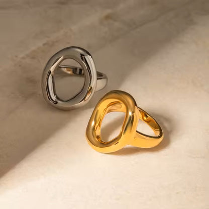 Gold and silver rings on a beige surface