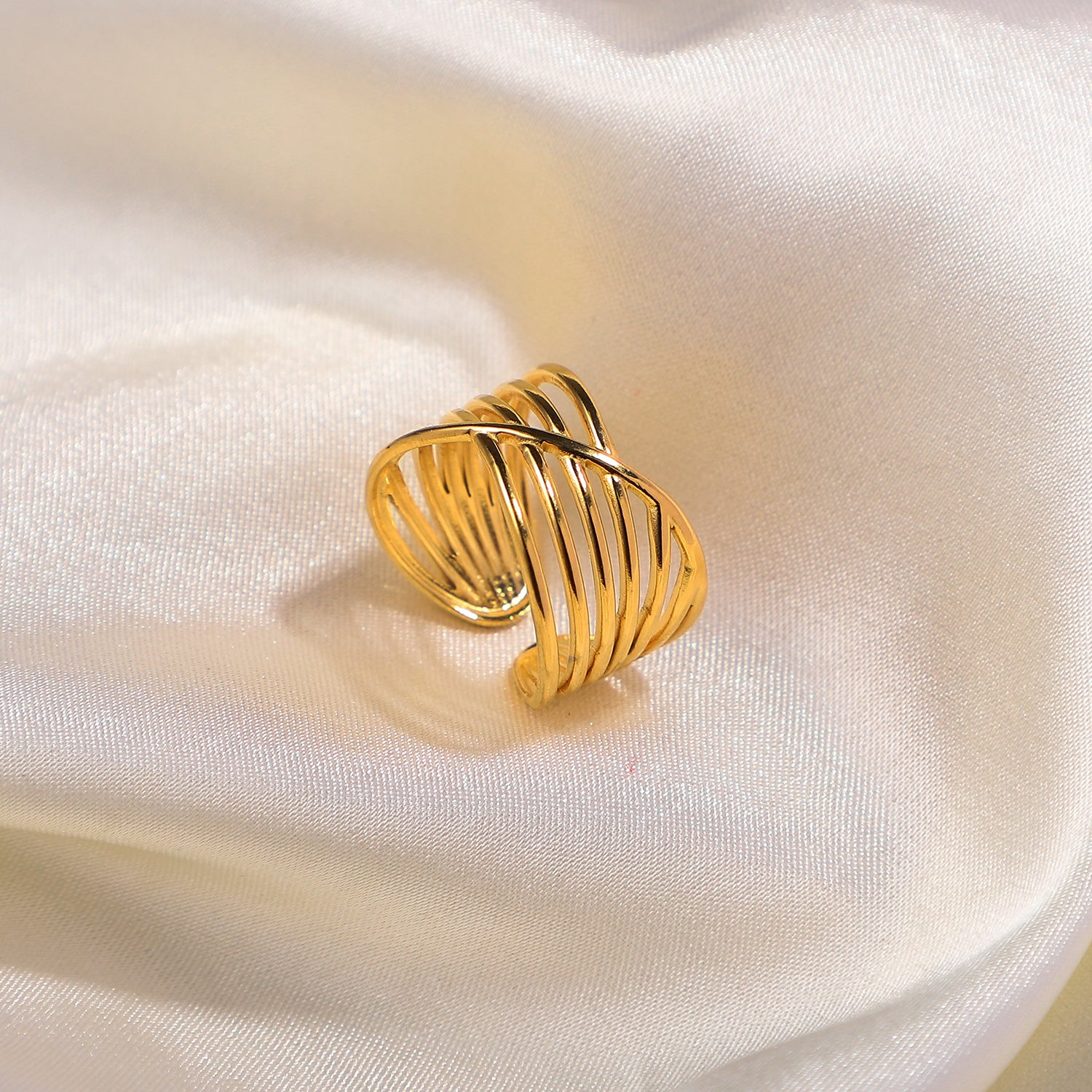 gold stainless steel ring on satin fabric