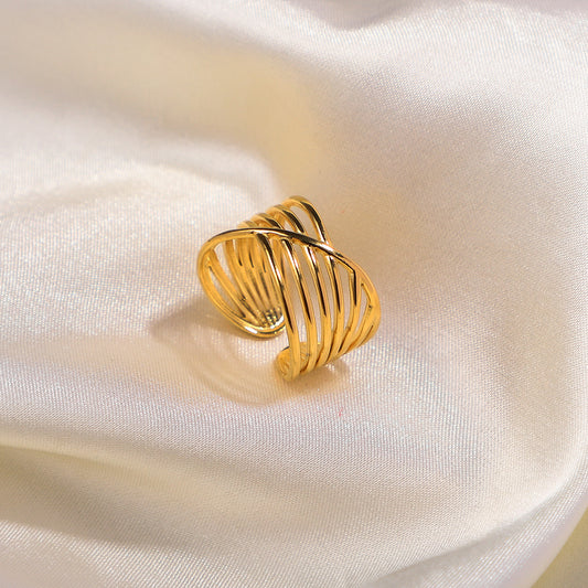 gold stainless steel ring on satin fabric