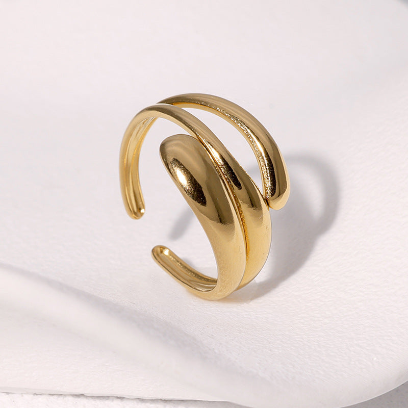 Gold ring on a white fabric background