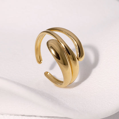 Gold ring on a white fabric background
