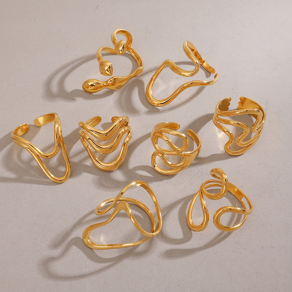 Gold ringlets on a light gray background