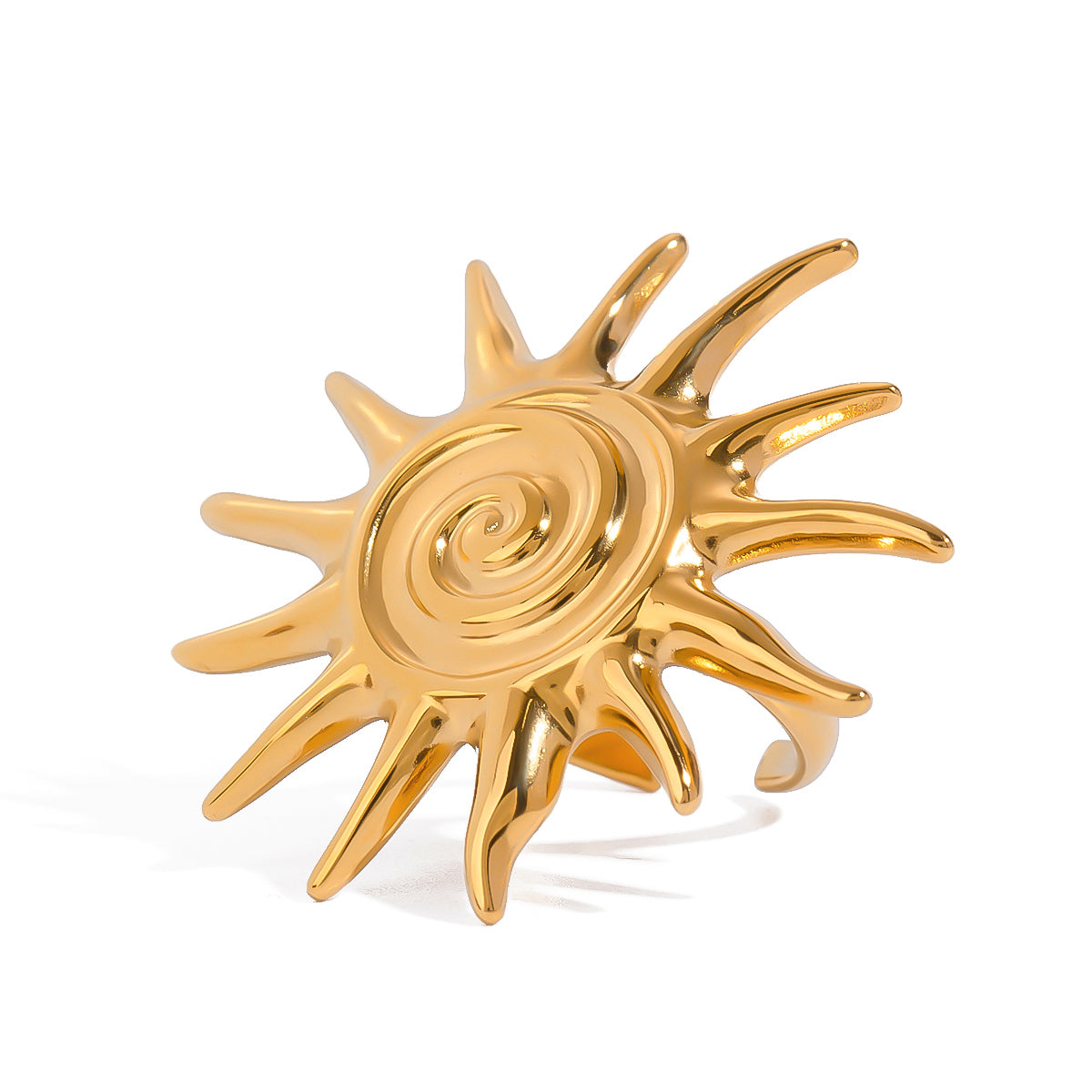 Gold sun-shaped ring on a white background