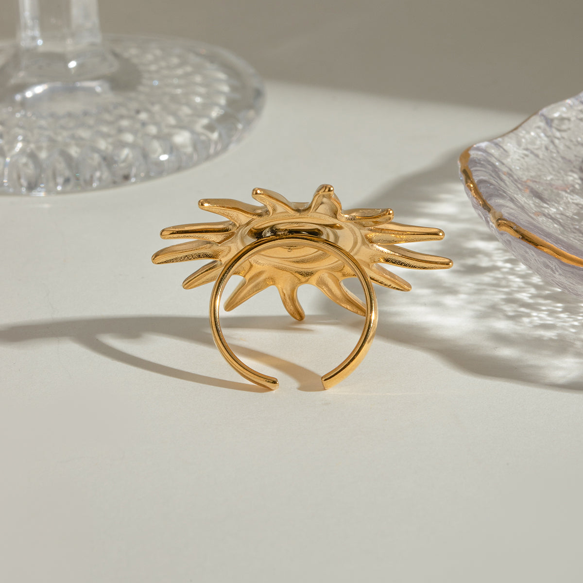 gold stainless steel ring in the shape of sun