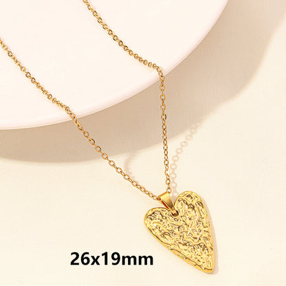 Gold waterproof heart-shaped pendant necklace on a beige background with dimensions 26x19mm.