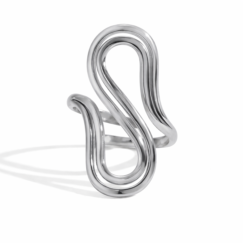 Silver ring with a modern, curved design on a white background