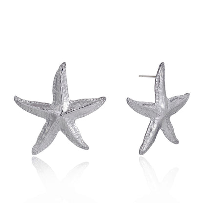 Starfish-shaped earrings on a white background